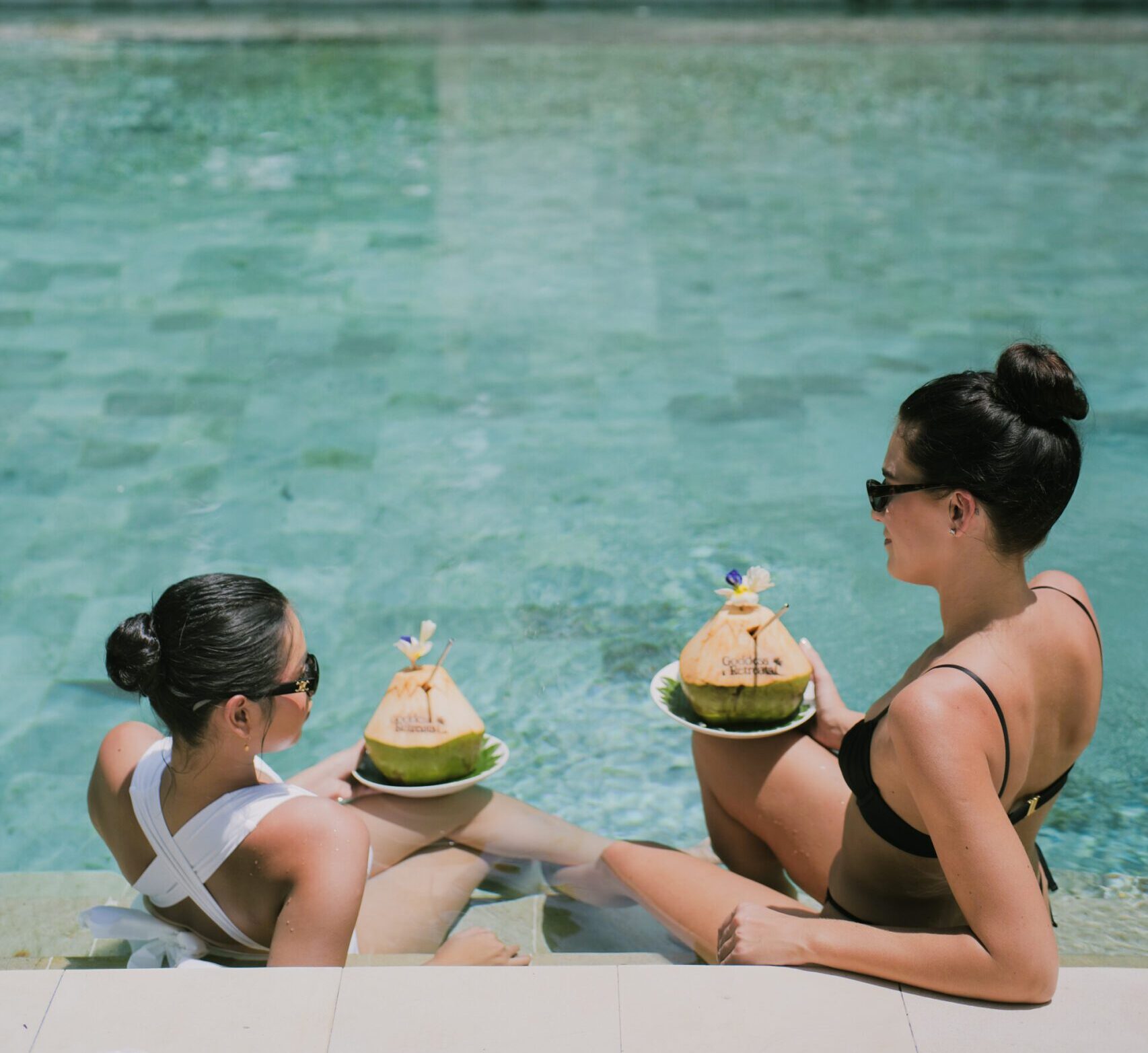 Women enjoying a long-term wellness retreat in Bali at the pool